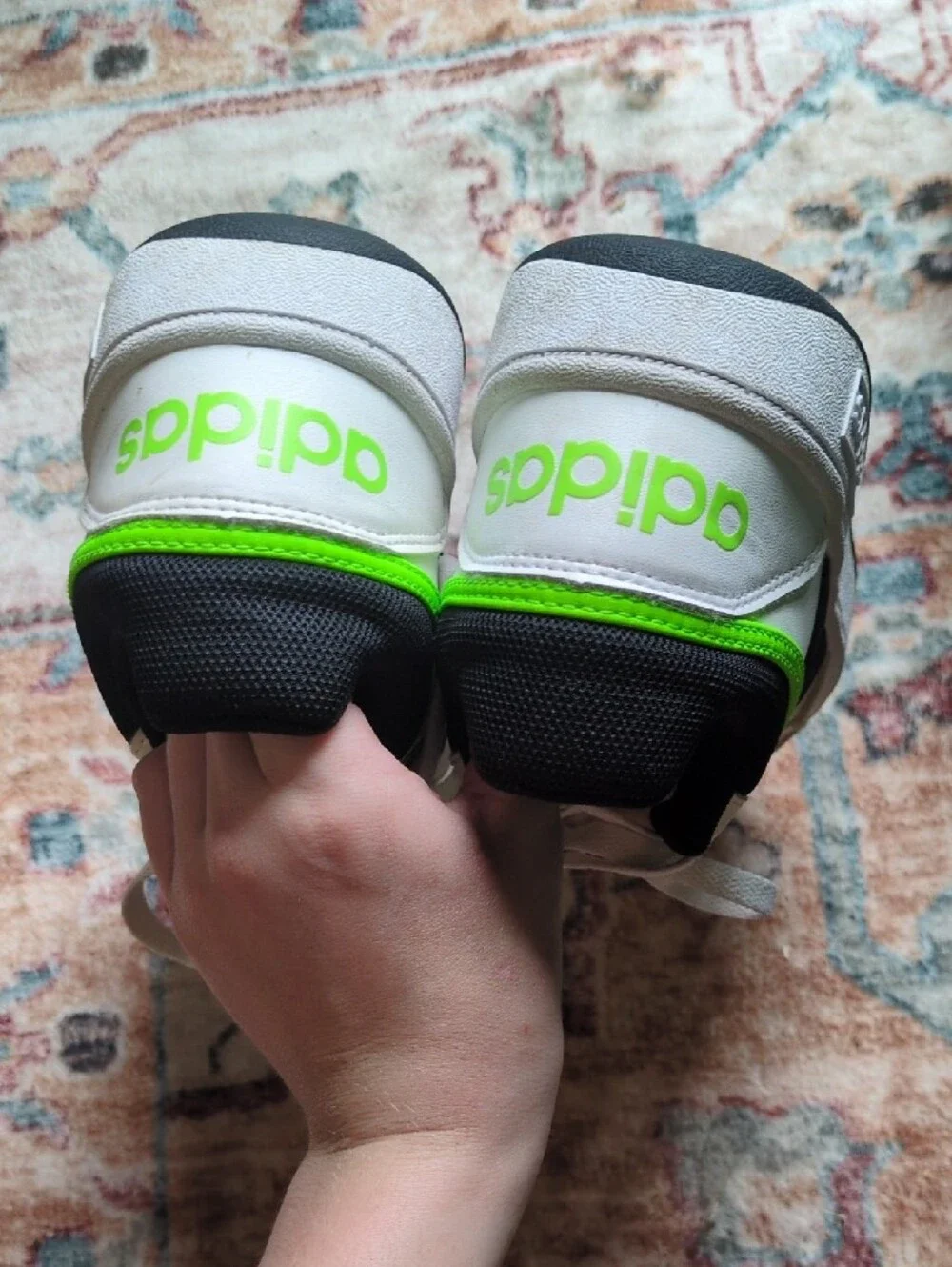 White Adidas Sneakers with Black Stripes and Neon Green Accent